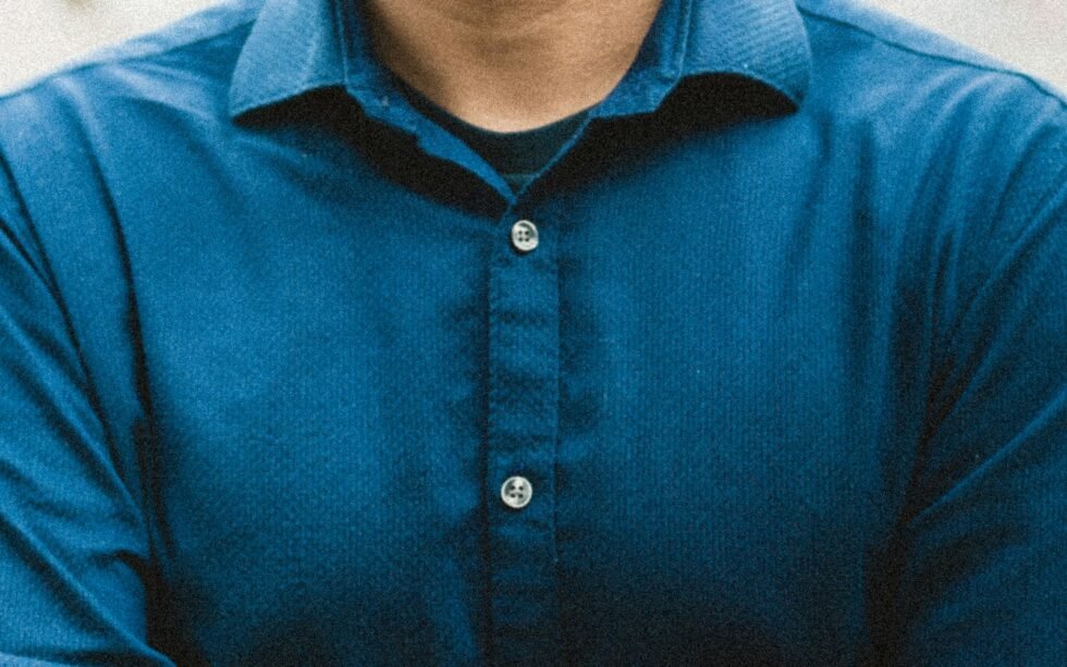 man in blue button up shirt